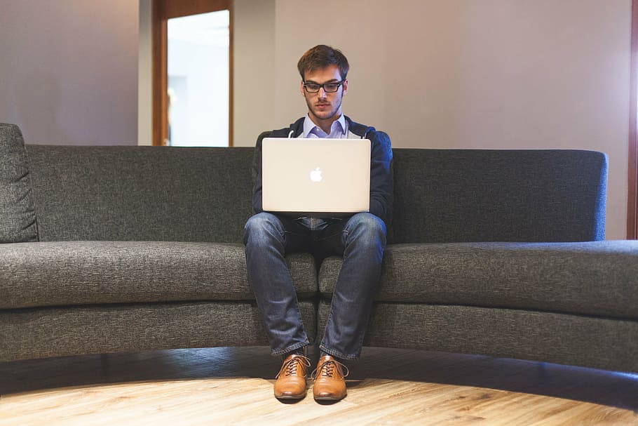 Woman, black, tank shirt, facing, laptop computer, brown, wooden, round ... Using Content Marketing to Drive Lifestyle Product Purchases